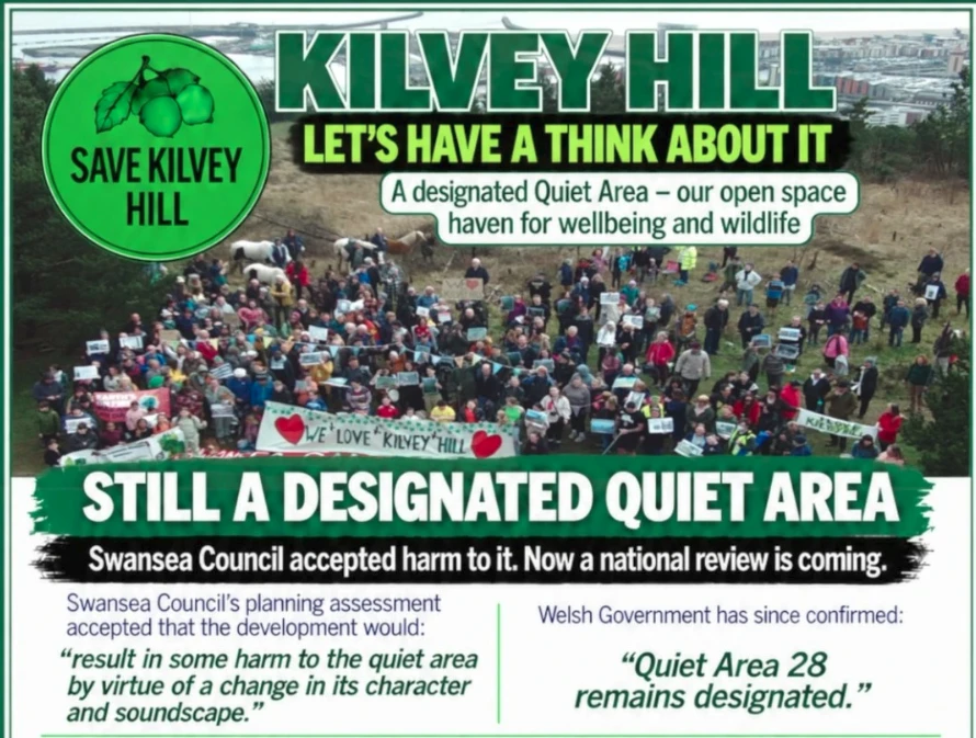 The Kilvey Hill community gathered on the hillside with campaign banners