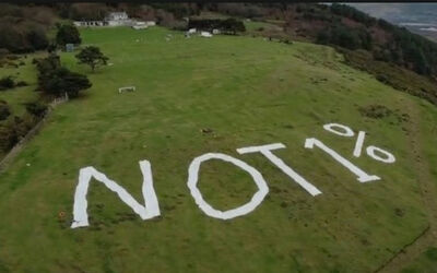 Kilvey Hill Summit with Not 1% text